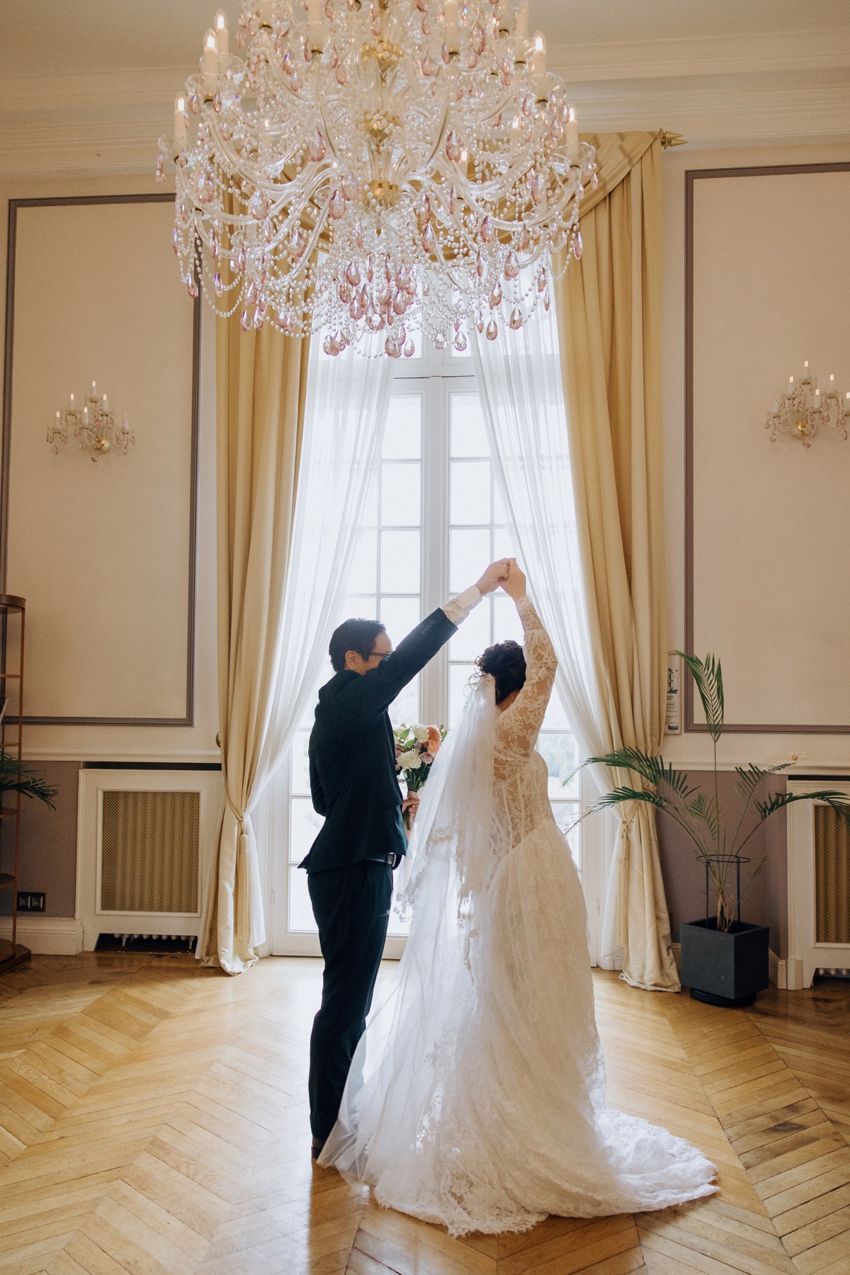 Bride preparing her wedding dress inside a French château